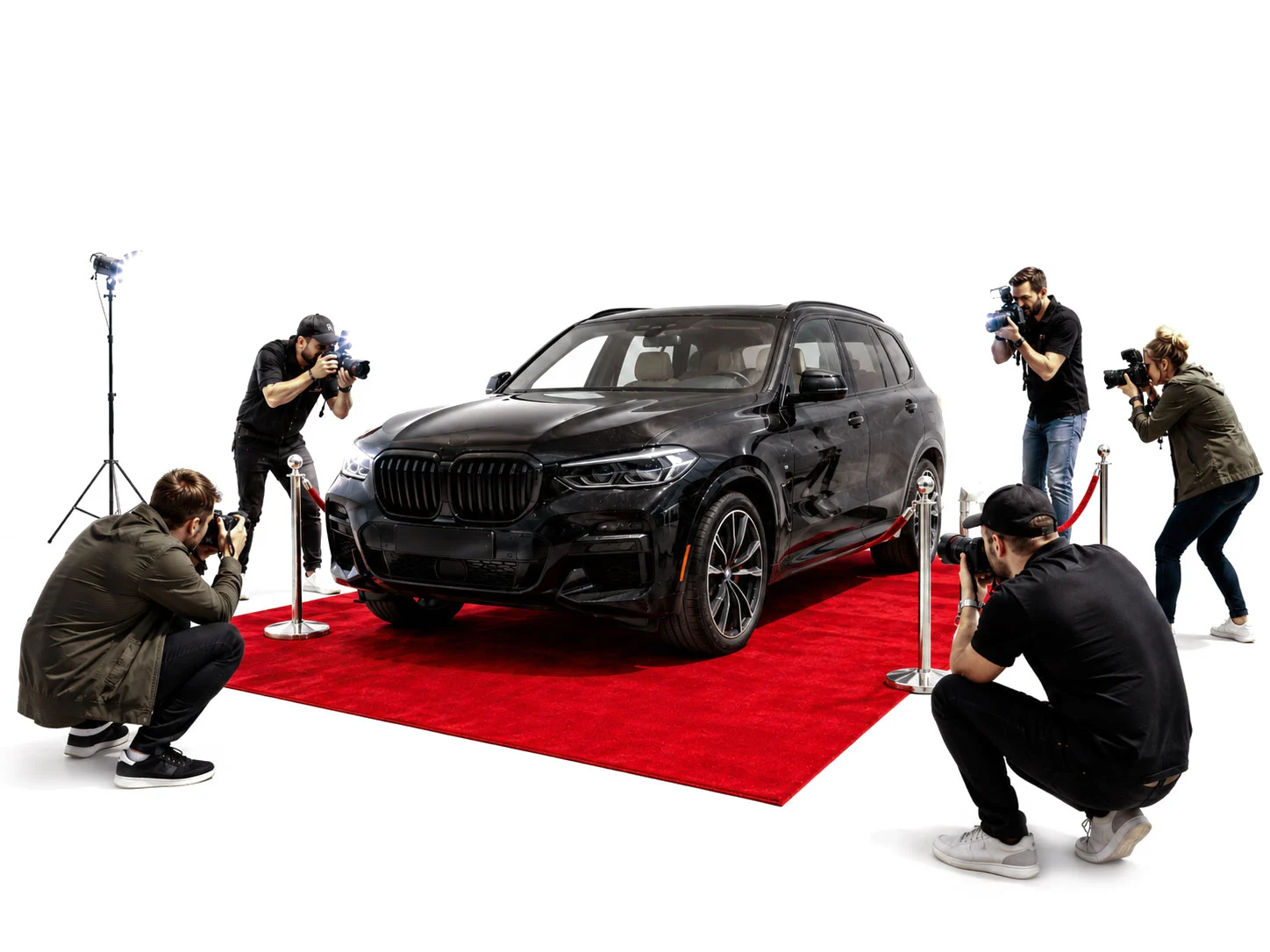 A crew photographing parts on a stripped car before teardown